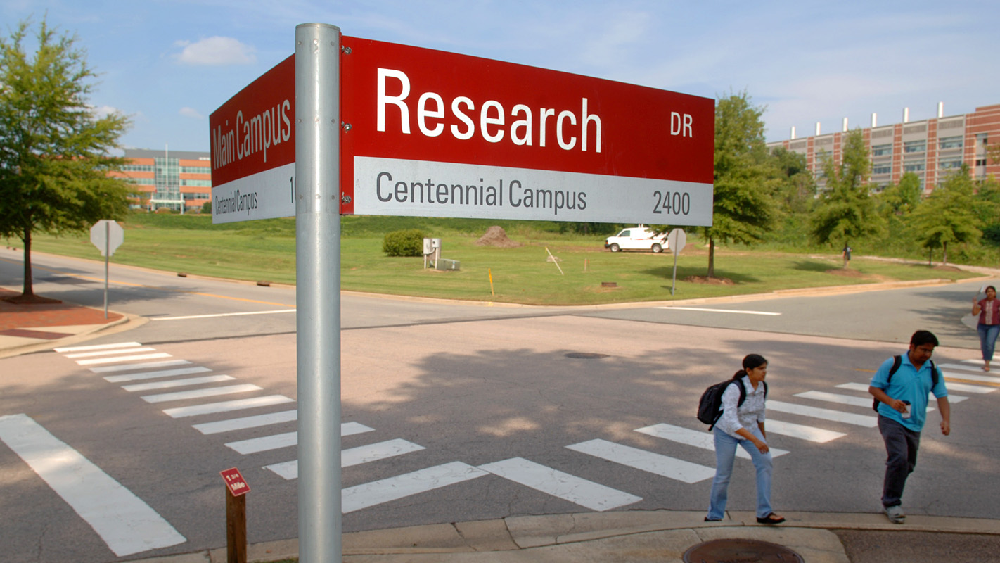 Students make their way across Centennial Campus past Research Drive.