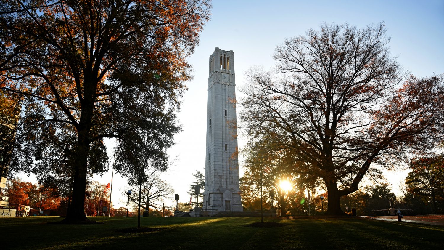 NC State Belltower surrounded by autumn trees