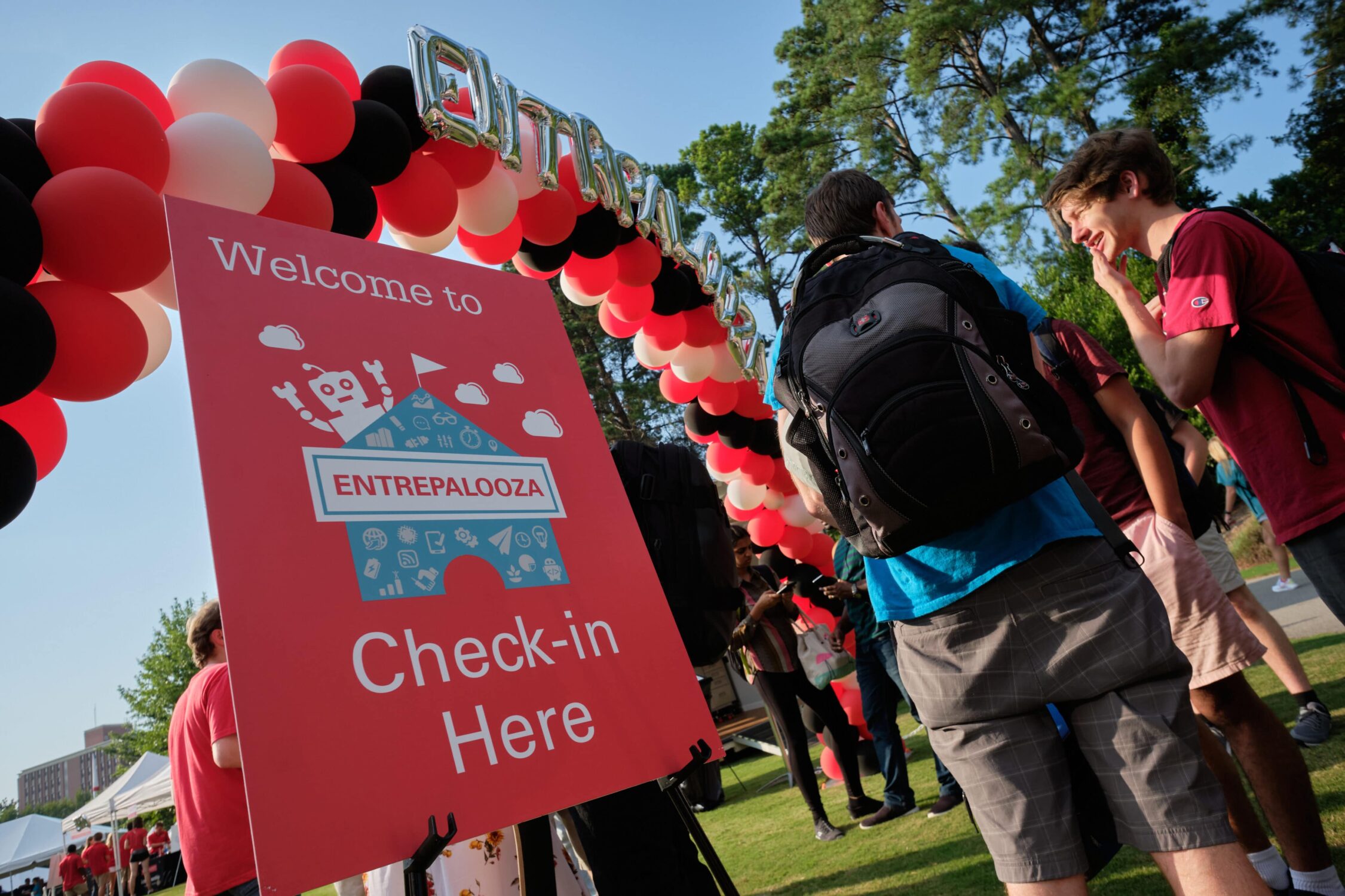 welcome sign under entrepalooza balloons