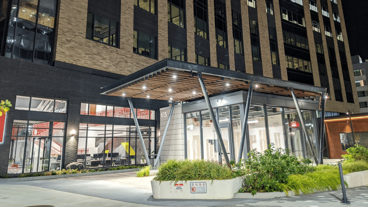321 coffee's storefront in downtown with store lights lit up at night