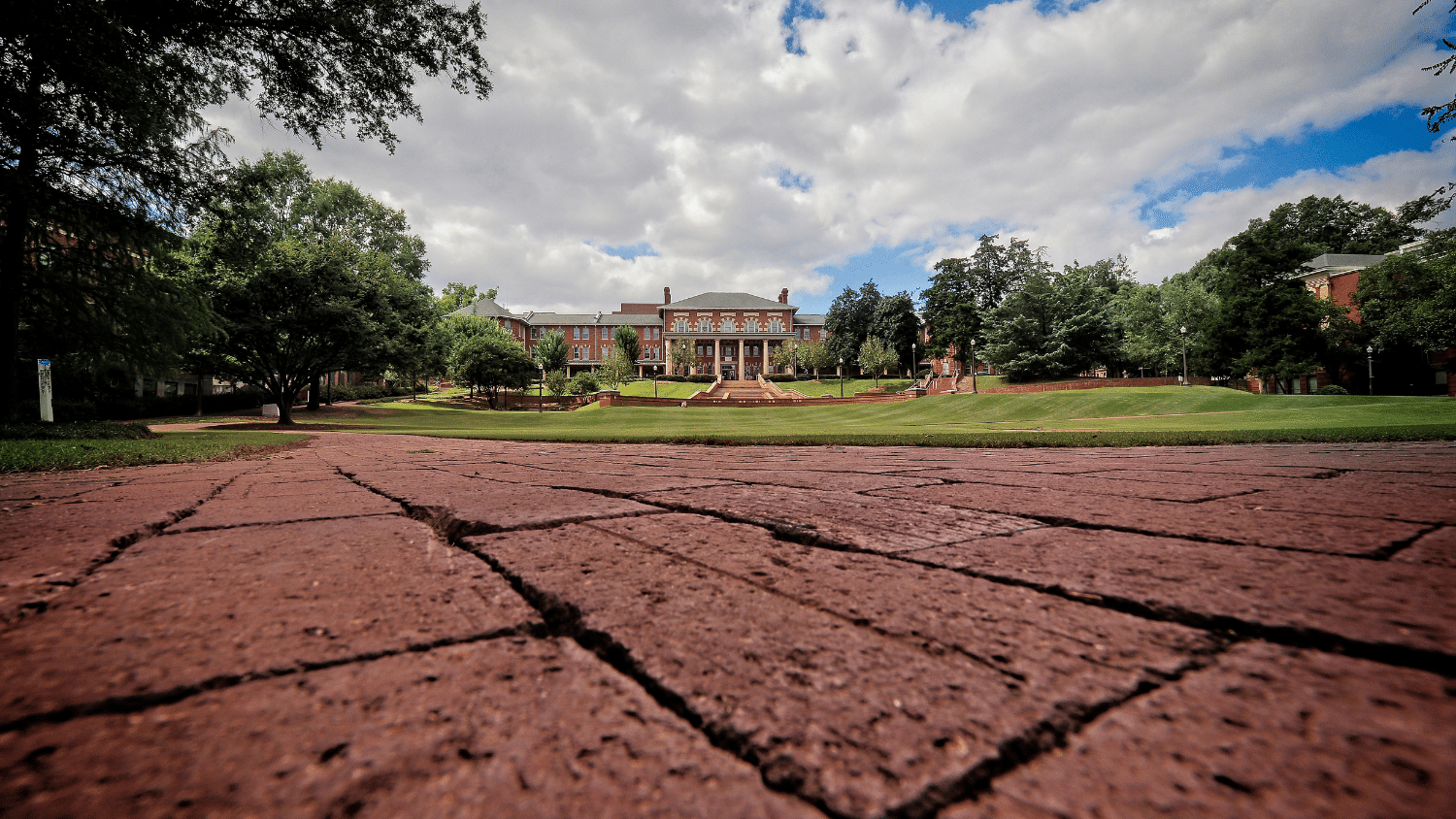 Court of Carolinas from wide scope angle showing bricks and blue sky full of clouds