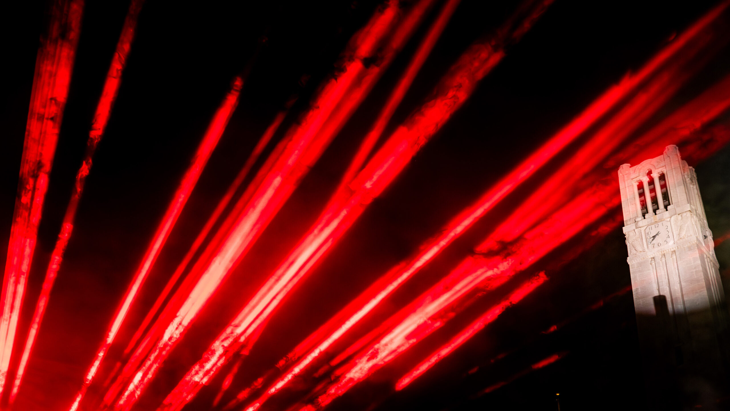 The Wolfpack community enjoyed a laser show at the Belltower during Packapalooza festivities on August 26, 2023. Photo by Becky Kirkland