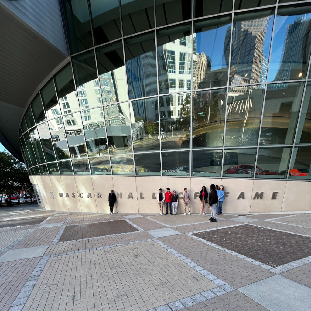 Students standing outside a large building